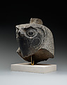 Falcon head with divine wig from a statue with an anthropomorphic body, Diorite