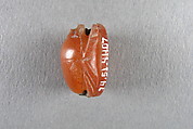 Scarab Inscribed with Horus Supporting the Sun Disk, Carnelian, copper