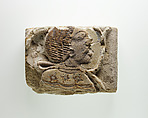Tile fragment with a head of a prisoner, Faience