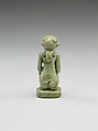 Nude crouching figure wearing a wreath, large phallus broken away, Faience