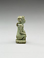 Nude crouching figure wearing a wreath, large phallus broken away, Faience