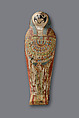 Falcon-form case containing a corn mummy, Painted gessoed wood; mummy: linen, resin, fiber