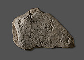 Raised Relief Fragment with a Male Figure Grasping an Object Decorated with Representations of Non-Egyptians, Limestone