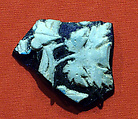 Cameo fragment with ivy and vine leaves from a skyphos (footed wine cup), cameo glass, white on blue