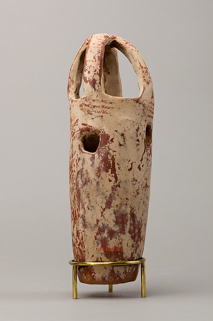 Censer? with floral design in red paint on white background