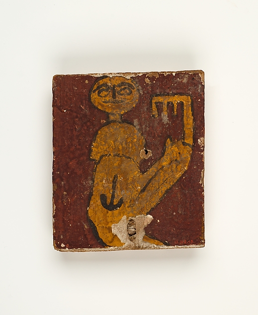 Panel with crouching figure holding a key, 100–300 CE