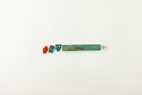 String of 3 amulets and 1 cylindrical bead