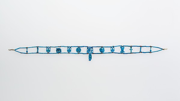 Necklace restrung with amulets and a faience cartouche bead of Tutankhamun