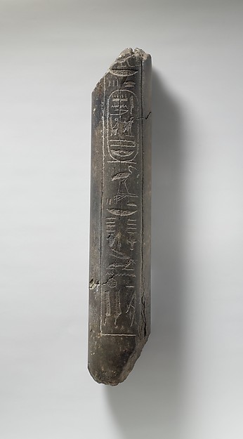 Fragment of a Statue of Haremhab bearing a standard
