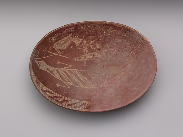 A shallow white cross-lined ware bowl illustrating a man on a boat alongside a hippo and crocodile