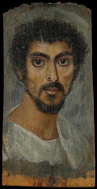 Portrait of a man with a mole on his nose