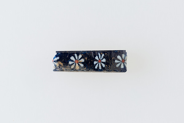Inlay fragment with row of rosettes