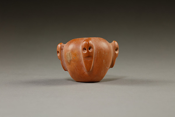 Piriform macehead with male faces