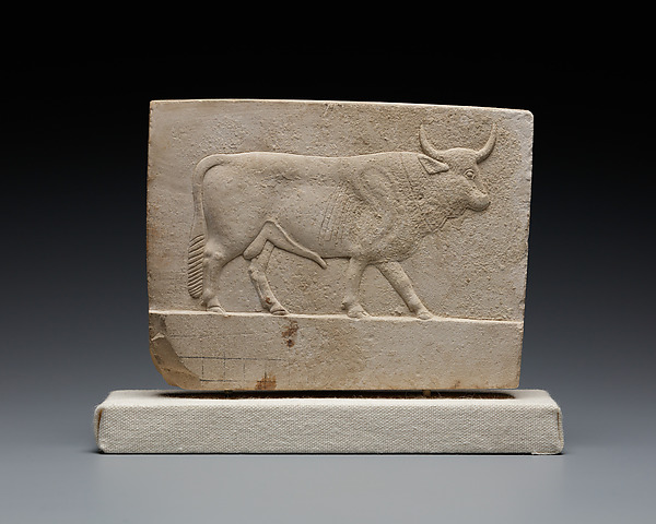 Relief plaque with a bull on one side and a ram on the other