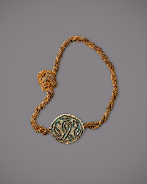 String Bracelet with a Cowroid Amulet