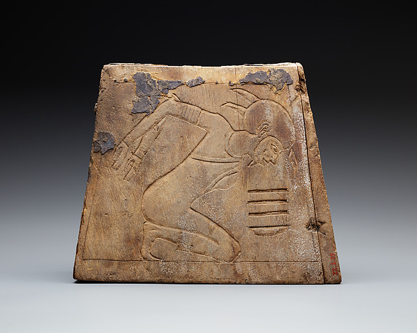 Wooden block with bound prisoner
