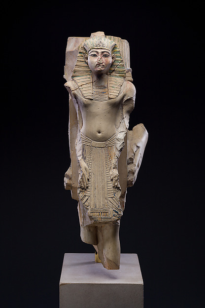 Figure of a king as part of a group proffered by an official of Ramesses II