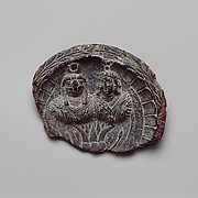 Shallow dish with high relief figures of Isis and falcon-headed Horusonerror=