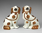 Pair of spaniels, Lead-glazed earthenware with copper lustre embellishments, British, Staffordshire