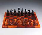 Chessmen (32) and board, Imitation amber, jet, British