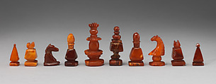 Chessmen (32) and board, Imitation amber, jet, British