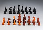 Chessmen (32) and board, Imitation amber, jet, British