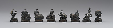 L to R: pawns representing signs of zodiac and phases of moon: 48.174.92ii–pp Astronomical chess set, Max Esser (German, Barth 1885–1945 Berlin), Silver, silver-gilt, ivory, ebony, marble, plaster, brass, beeswax, enamel, German, Berlin