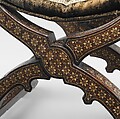 Hip-joint armchair (sillón de cadera or jamuga), Walnut and elm, partly veneered and inlaid with different woods, ivory, bone (camel?) and pewter; covered in silk velvet not original to the armchair, Spanish, Granada