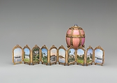 Danish Palaces Egg, House of Carl Fabergé, Green, rose, and quatre-couleur gold, guilloché enamel, star sapphire, cabochon emerald, rose-cut diamond nacre, crystal crimson silk velvet, Russian, St. Petersburg