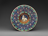 Wide-rimmed bowl with winged putto, Workshop of Maestro Giorgio Andreoli (Italian (Gubbio), active first half of 16th century), Maiolica (tin-glazed earthenware), lustered, Italian, Gubbio