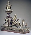 Mantel clock, Case: carved and gilded wood; Revolving rings for hours and minutes: gilded brass; Movement: brass and steel, probably Austrian