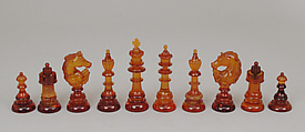 Chessmen (32) and box-board, Amber, leather, brass, German