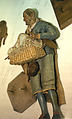 Poultry vendor with base, leather hat, and two roosters, Polychromed terracotta head and wooden limbs; body of wire wrapped in tow; cotton and leather garments or accessories; wicker basket with mixed media, Italian, Naples