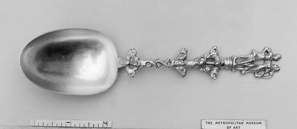 Figure-top spoon