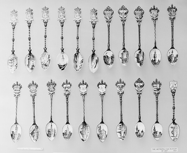 Souvenir spoon with view of with tower at Coruña and arms of Spain