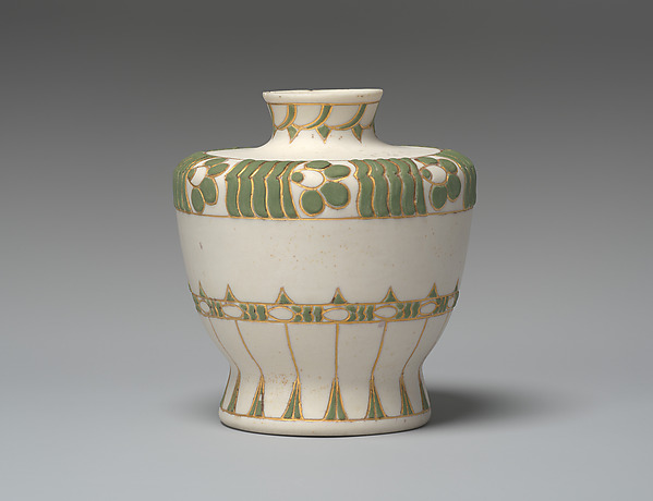 Vase with green and gold decoration on white