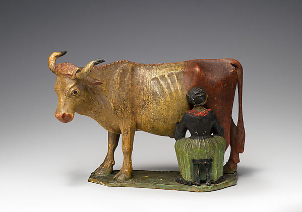 Girl milking a cow