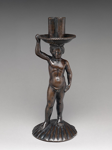 Boy on a shell, holding a candlestick