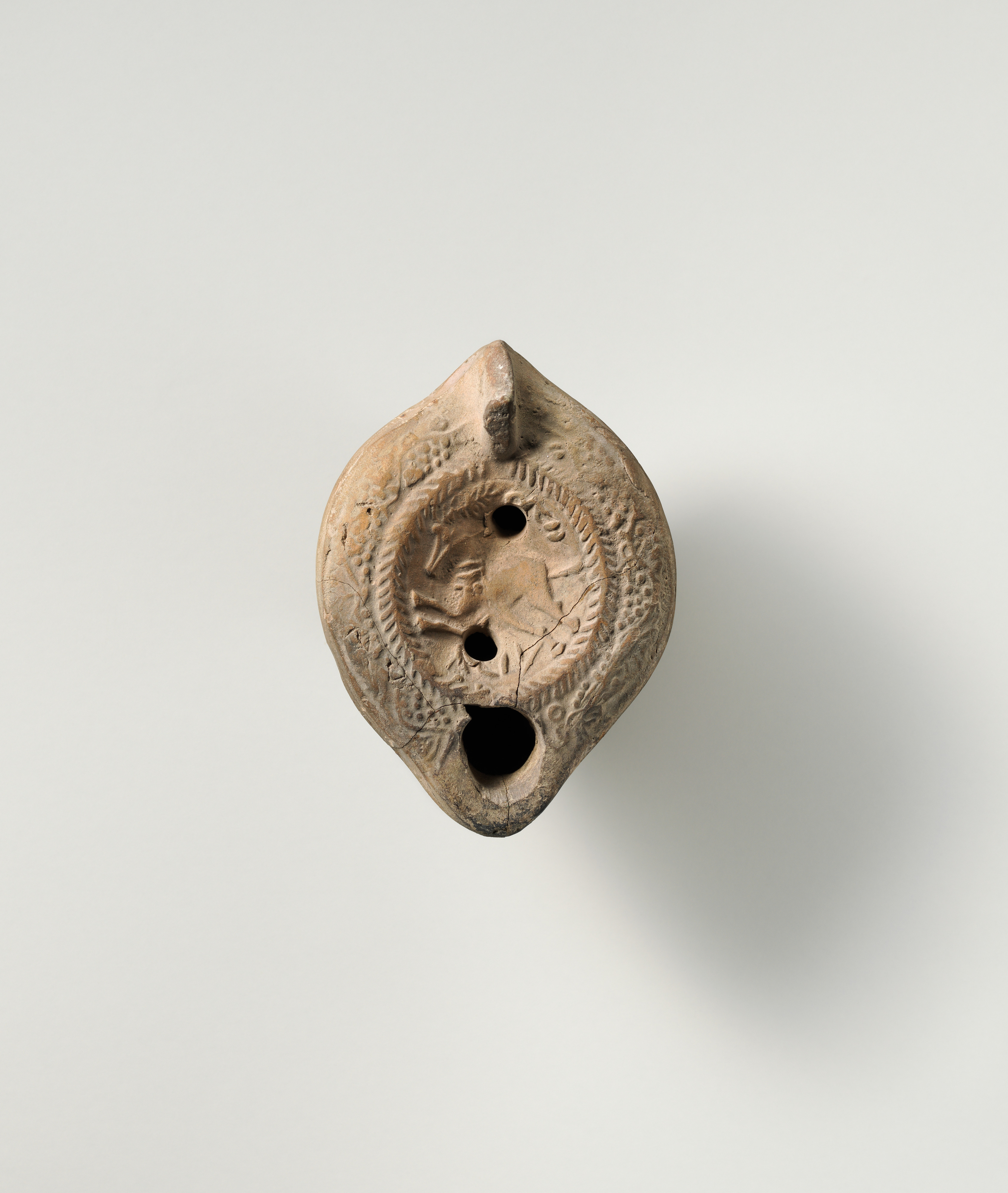 Terracotta oil lamp