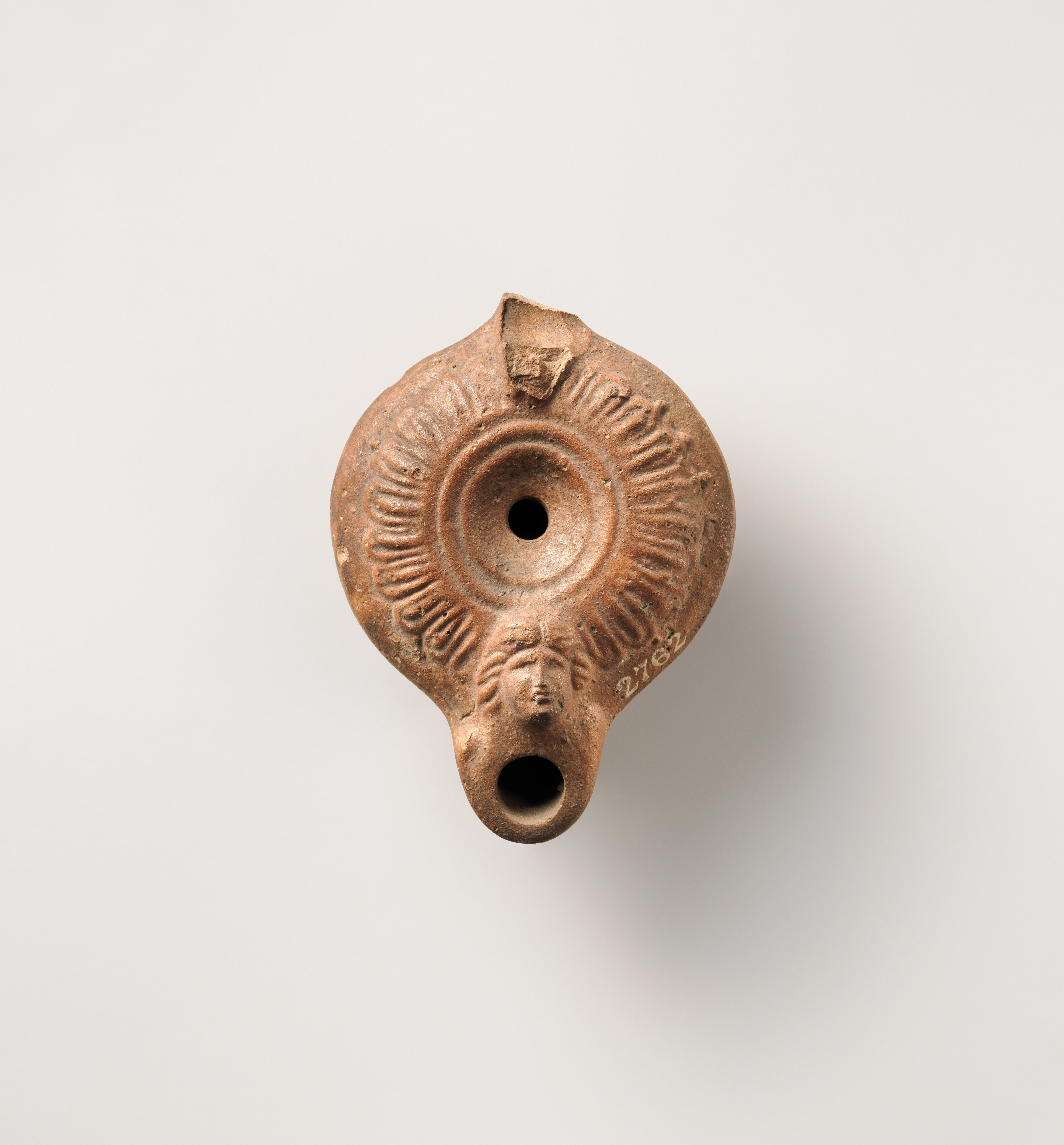 Terracotta oil lamp