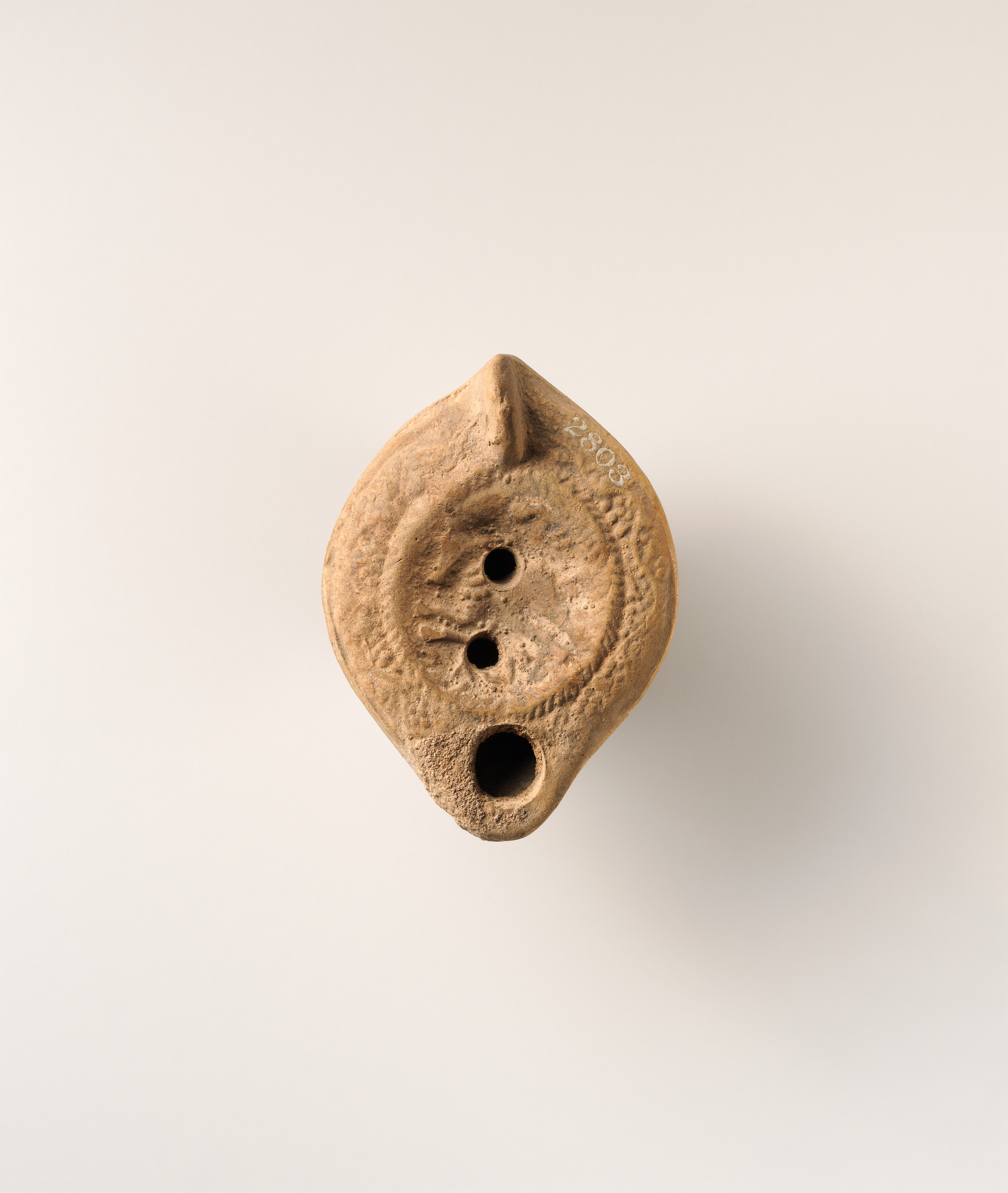 Terracotta oil lamp
