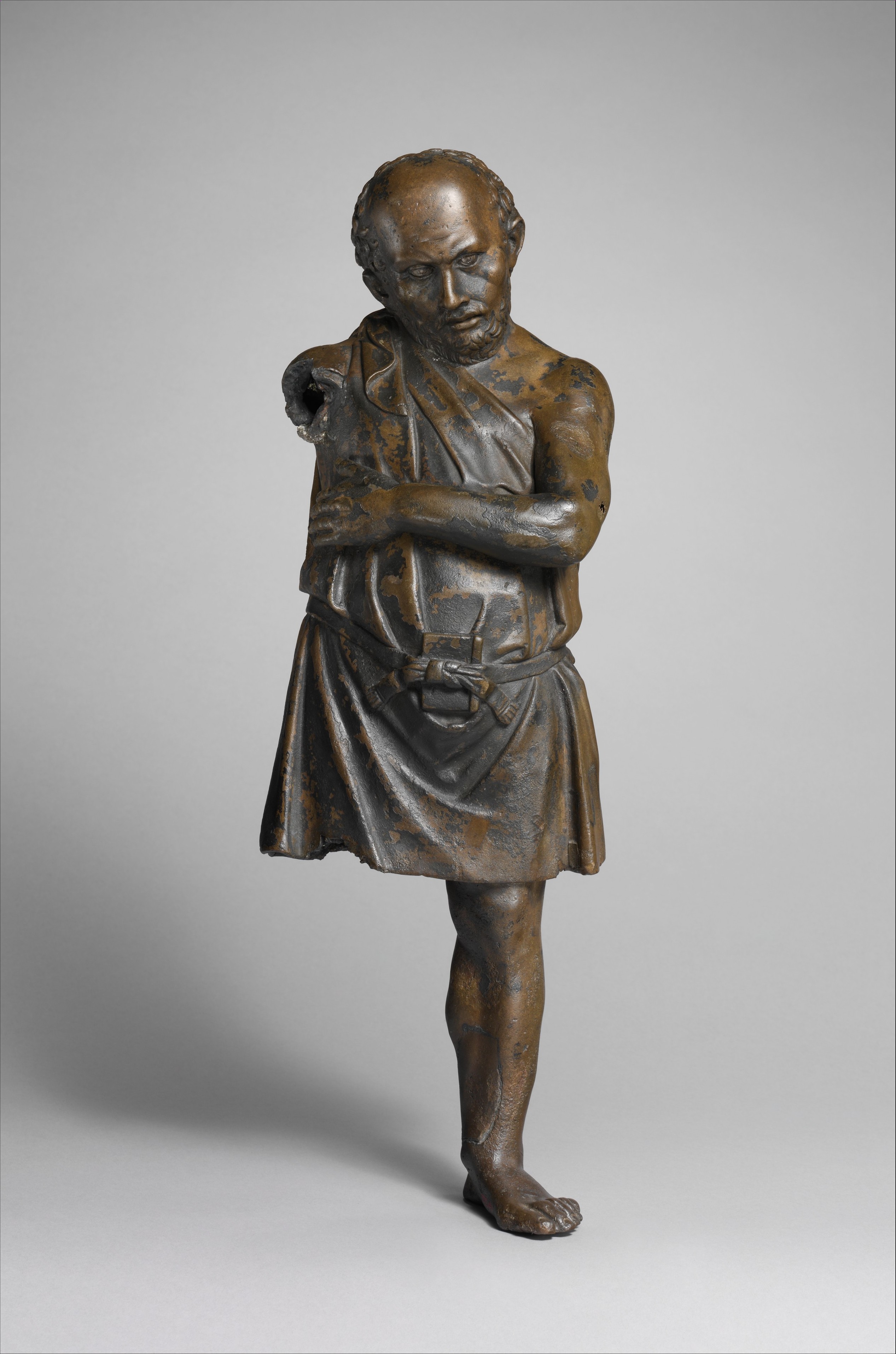 Bronze statuette of an artisan with silver eyes, Greek