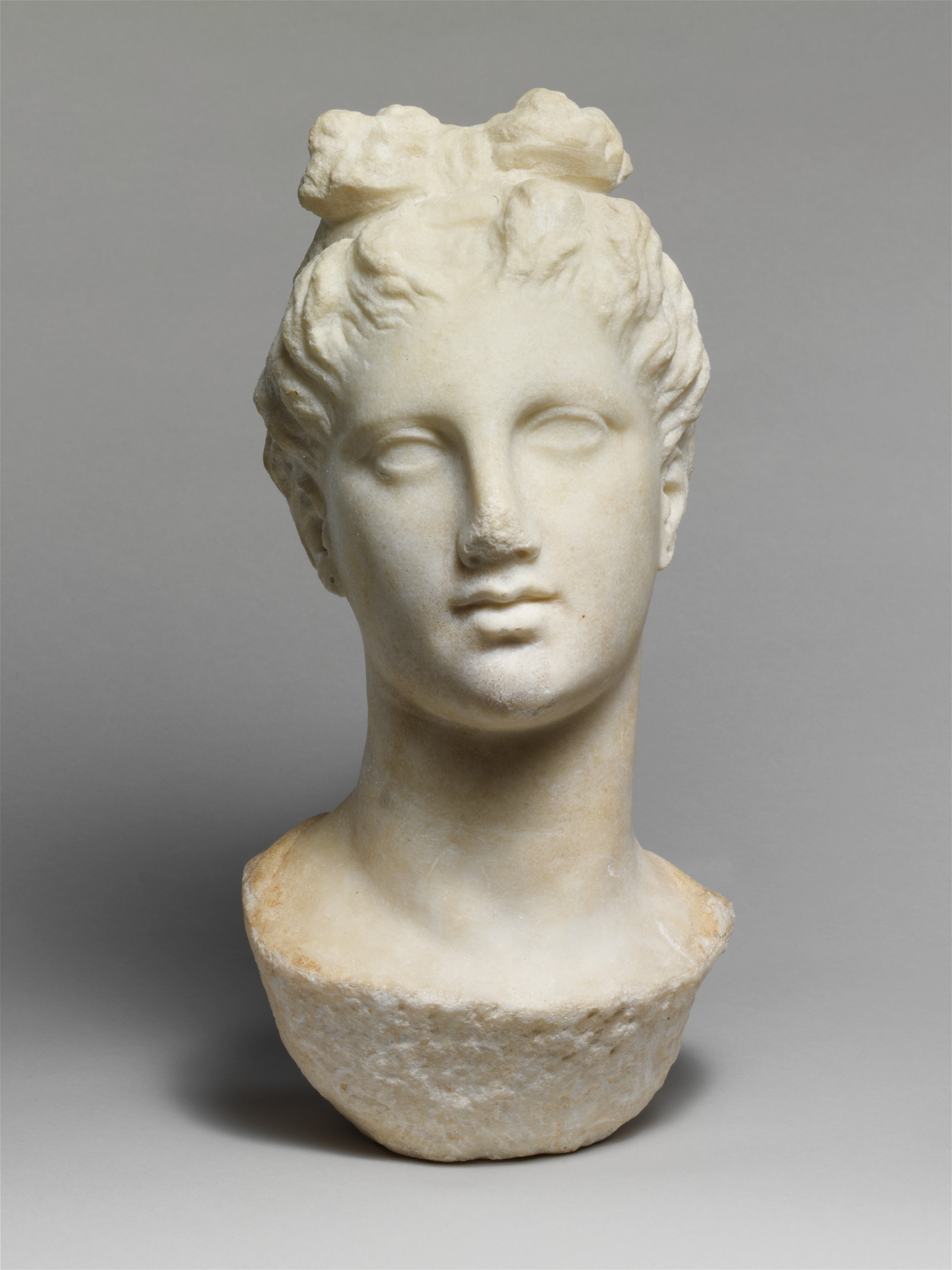 Marble head of a young woman from a funerary statue Greek, Attic