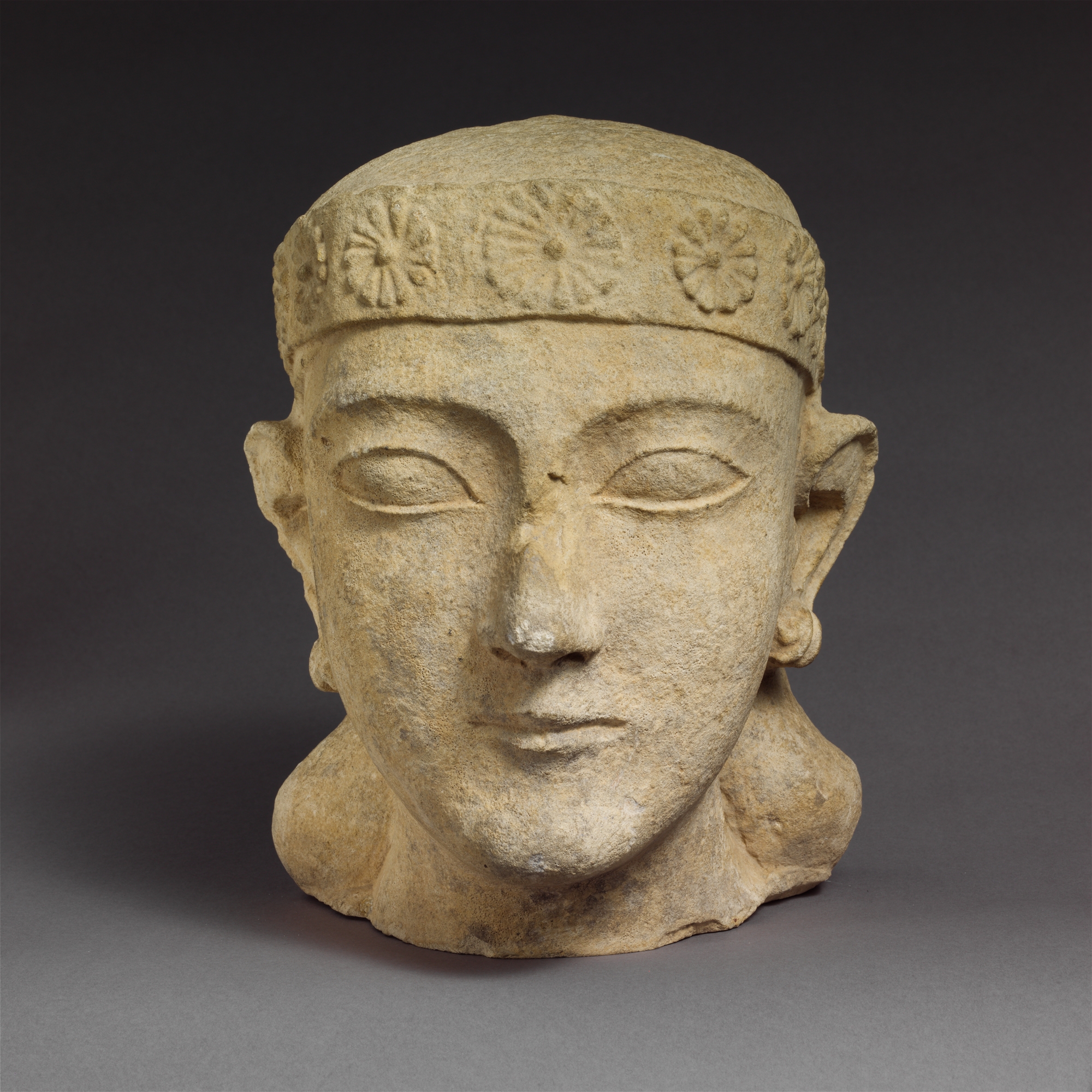 Limestone head of a beardless male with a diadem | Cypriot | Archaic ...