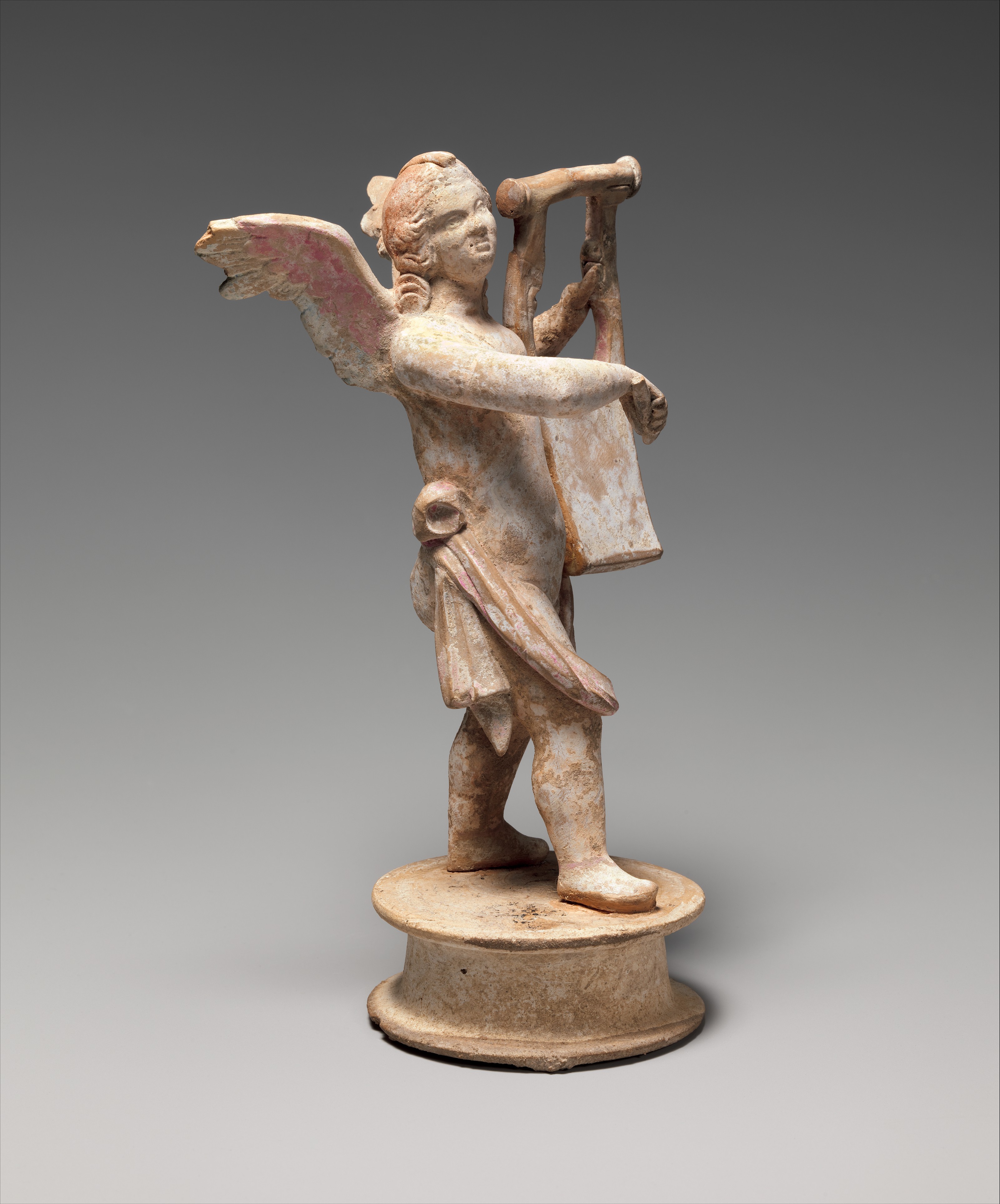 Terracotta Statuette Of Eros Playing A Lyre Greek Hellenistic The Terracotta Statuette Of Eros Playing A Lyre Greek Hellenistic The