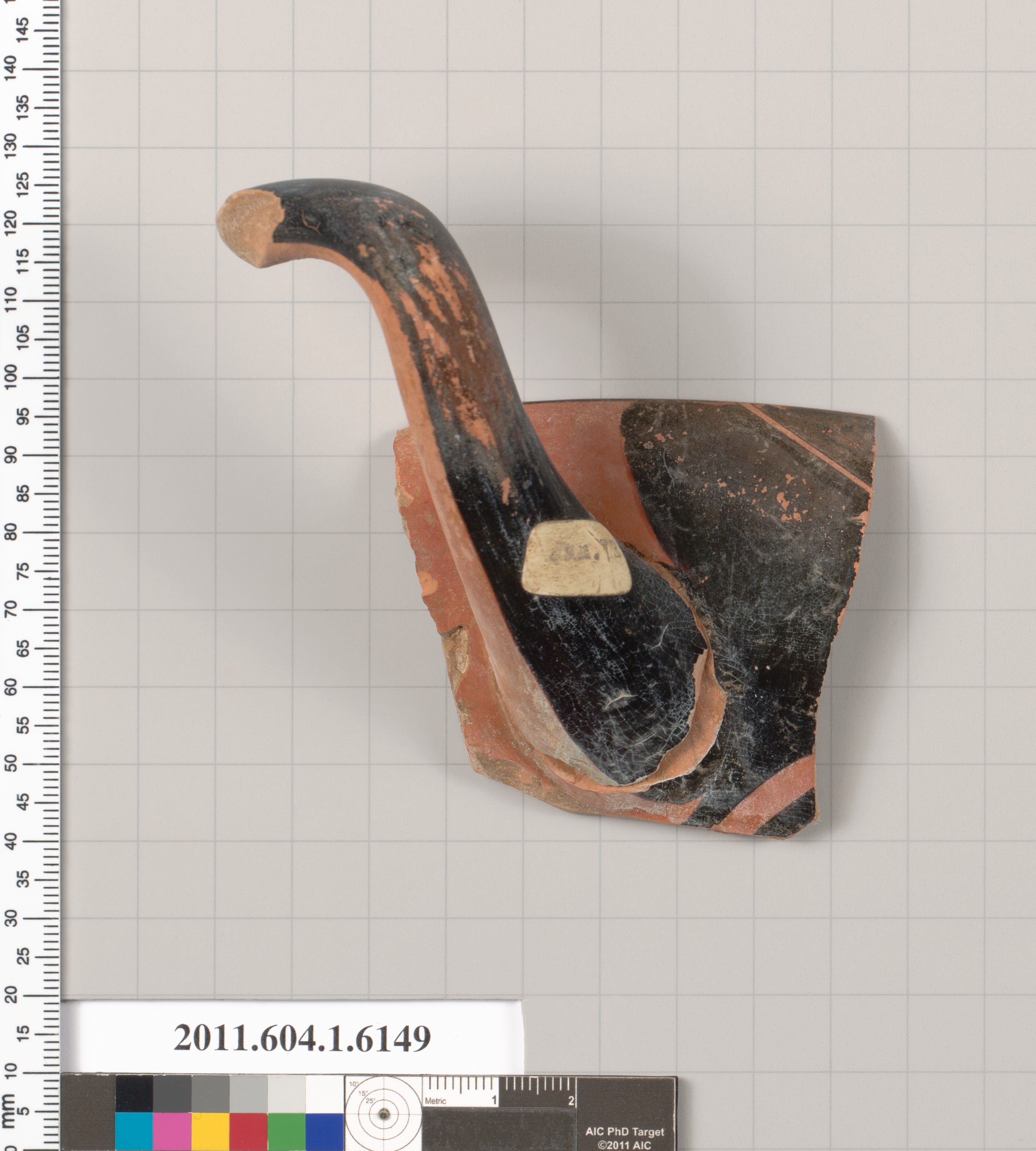 Terracotta fragment of a kylix (drinking cup)