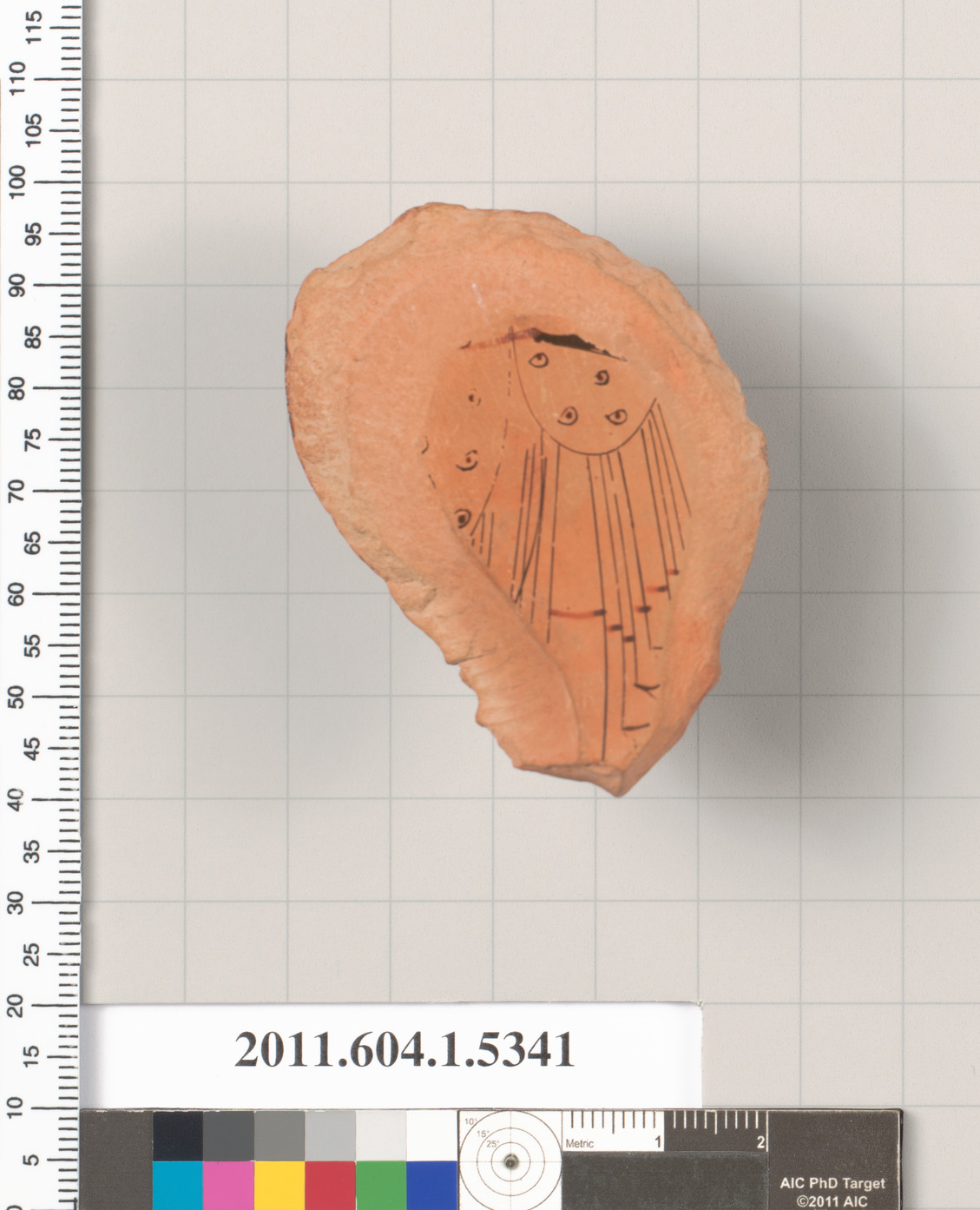 Terracotta fragment of a kylix (drinking cup)