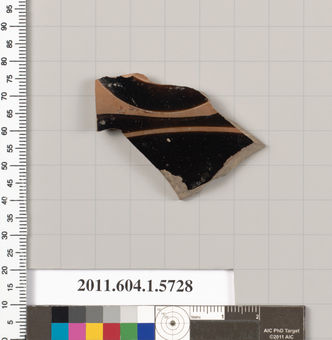 Terracotta fragment of a kylix: eye-cup  (drinking cup)