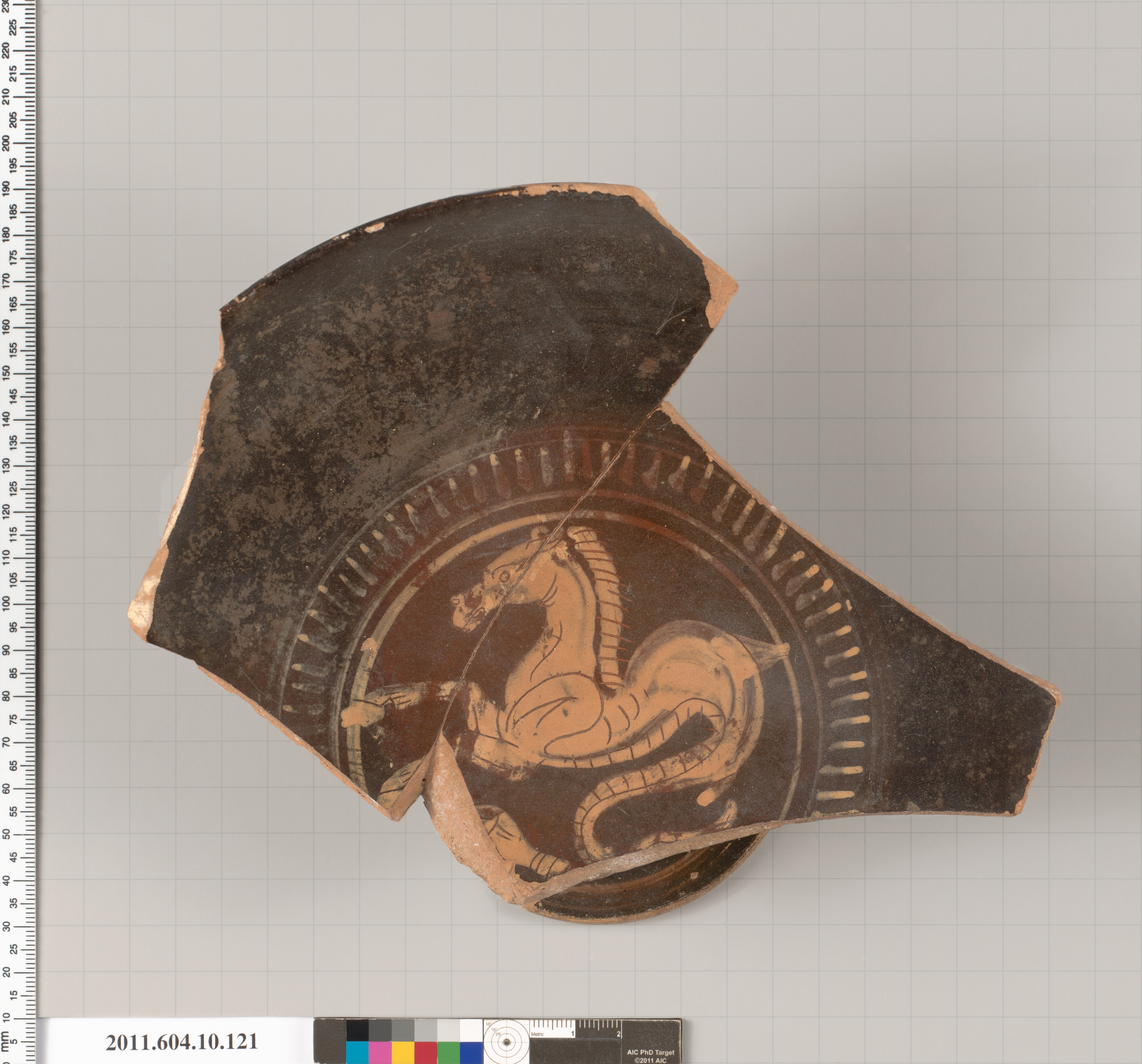 Terracotta fragment of a kylix (drinking cup)