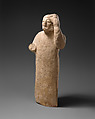Limestone figure holding a mask, Limestone, Cypriot